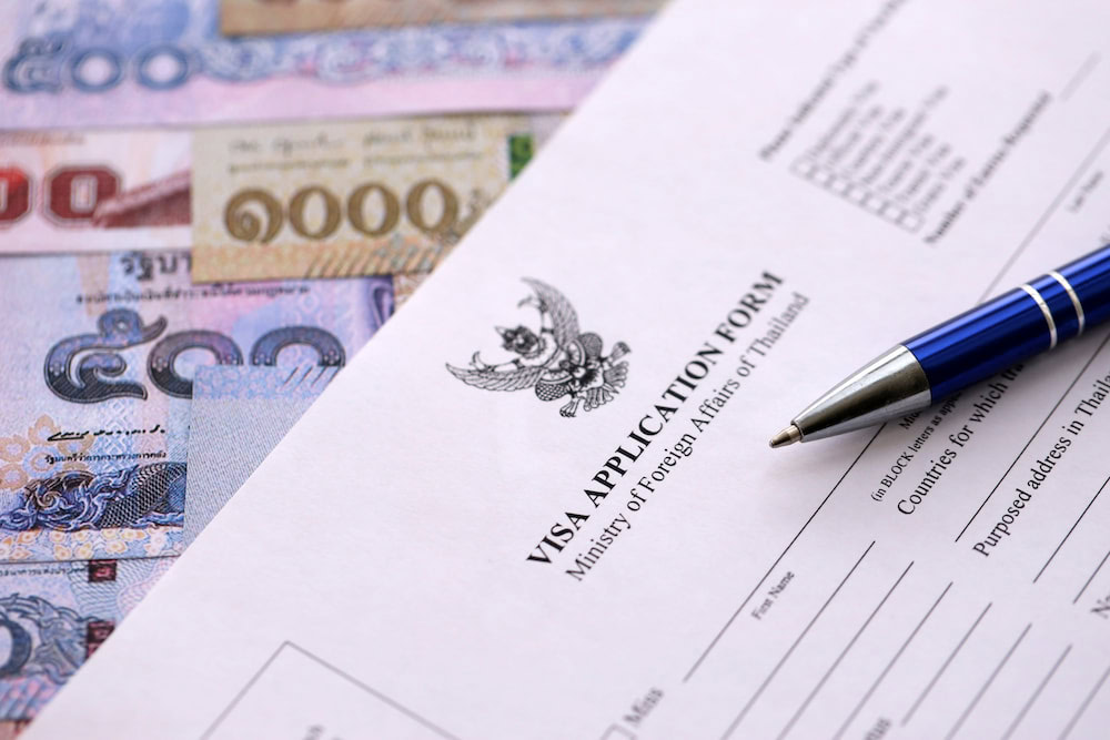 difference between LTR visa and retirement visa Close-up of a Thailand visa application form on a desk